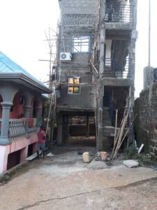 Three-storey building before it collapsed
